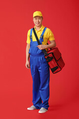 Courier of food delivery service on color background