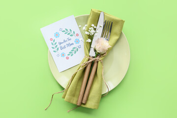 Beautiful table setting for Mother's Day on color background