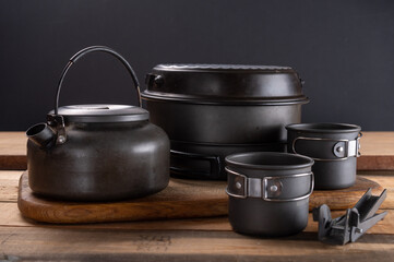 A set of tourist utensils for hiking in nature. A pot and kettle for tourism.