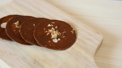 Close Up Chocolate Cookies on wooden plate