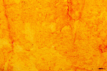A beautiful orange-yellow color handmade paper of abstract red spots. Useful for background, 3d rendering.