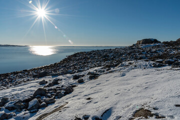 Sun beams at sea in winter
