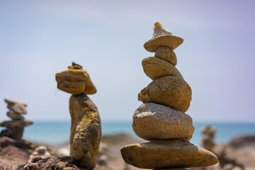 Fototapeta na wymiar Balanced stones on the beach