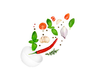 Tomato, basil, spices, chili pepper, garlic fresh thyme, onion flying. Vegan diet food isolated on white. Falling into bowl, levitation fly. Creative concept