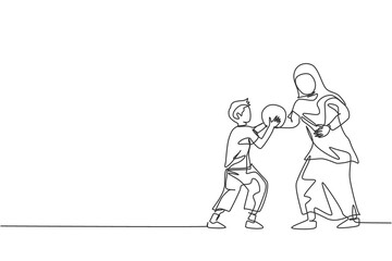 One single line drawing of young Islamic mother playing basketball sport with her son at public park vector illustration. Arabian muslim family parenting concept. Modern continuous line draw design