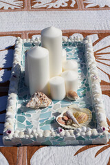 Japanese Sea Glass trays, they are a mosaic style. They are very beautiful. There are white candles as well and the photos are taken in Japan