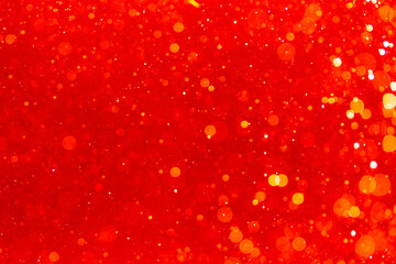 Red bokeh of light textured glitter