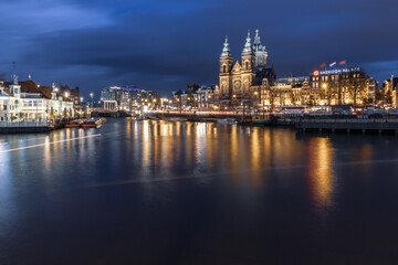 Night cityscape in the Amsterdam harbor in Netherlands