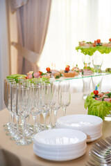 Empty glasses set, Elegant table setting for a festive dinner in the restaurant. Snacks on the buffet table