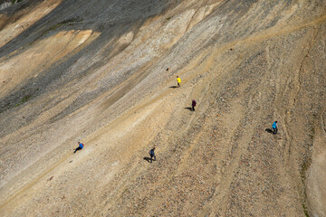 Fototapeta na wymiar Hikers in volcanic mountains of Landmannalaugar in Fjallabak Nature Reserve. Iceland