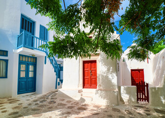 Romantic traditional narrow cobbled streets, beautiful small squares of Greek island towns. Whitewashed houses, small chapels. Mykonos, Greece.