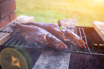 river fish smoked on the grill. artistic focus