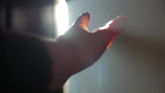 Sun ray man hand left POV dust indoors light