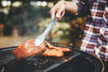 barbecue camping with grill crispy pork at night