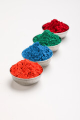 Indian festival Holi , Multi color's bowl on white background