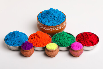 Indian festival Holi , Multi color's bowl on white background