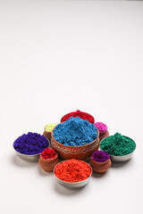 Indian festival Holi , Multi color's bowl on white background