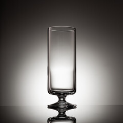 Isolated glass of traditional raki beverage backlit on gradient background
