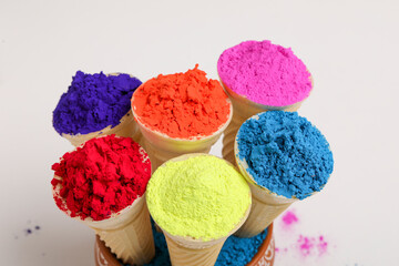 colors in shapes of ice cream scoops in cones for Indian holi festival