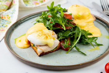 breakfast. Toast with boiled pork, cheese, poached egg and arugula and tomato salad dressed with butter.