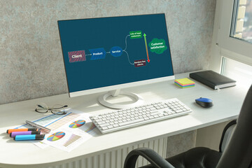 Workspace with pc with diagram. Soft focus and blur on first plan.