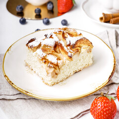 Delicious cake with fruits on background