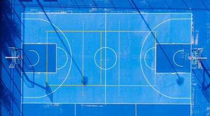 Multi purpose sports court, with Basketball, Soccer and Tennis marks.