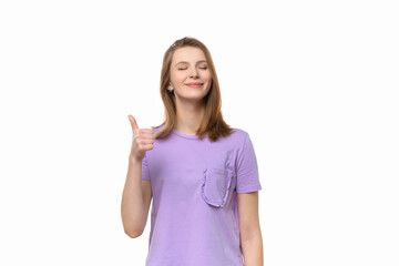 Beautiful young woman wearing casual tshirt showing thumb up gesture and smiling