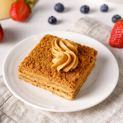 Delicious cake with fruits on background