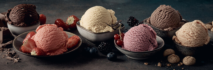 Appetizing ice cream scoops with fresh berries and biscuits