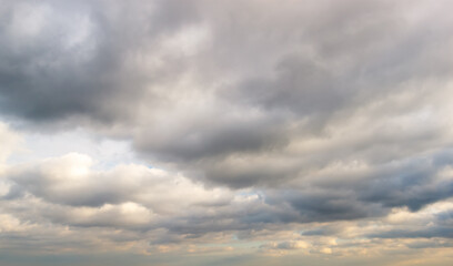 Obraz premium Dark cloudy sky in evening time with blue and yellow colors