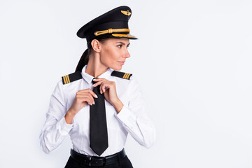 Photo of lady adjust tie self-assured look side empty space wear aviator uniform isolated white color background © deagreez