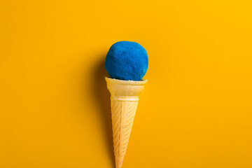 colors in shapes of ice cream scoops in cones for Indian holi festival