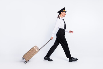 Profile photo of girl go carry suitcase look empty space wear aviator headwear uniform isolated white color background © deagreez