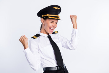 Portrait of attractive lucky cheerful pilot girl rejoicing good luck having fun business trip isolated over white color background