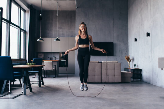 Woman Skipping With Jump Rope At Home.