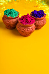 Indian Festival Holi, Multicolor's wooden bowl on dark background