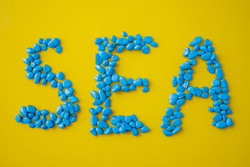 Inscription of the sea on a yellow background