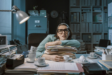 Stressed employee working late at night
