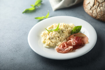 Homemade scrambled eggs with smoked ham