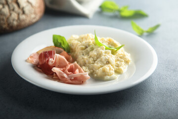 Homemade scrambled eggs with smoked ham