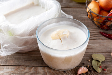 Frozen broth in a container on a table