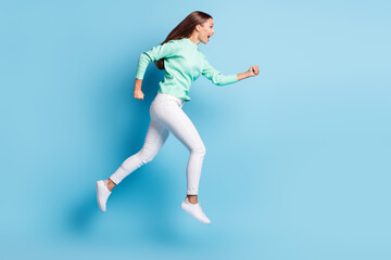 Fototapeta na wymiar Profile photo of shiny cute girl wear casual outfit hurrying running hands fists open mouth isolated blue color background