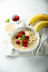 Healthy oatmeal porridge with fresh raspberry