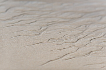 Fototapeta na wymiar Pattern and textures in the sand on a beach on Sylt island Germany