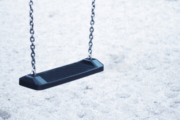 Wooden swing with metal chains for children