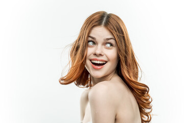 Fototapeta premium cheerful pretty woman with bare shoulders isolated background smile studio