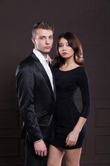 A young woman and young men in a romantic photo session, their love story.