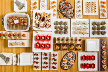 Mini burgers with meat on the table prepared for the guests of the event. Catering and guest meals during the event.