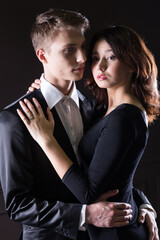 A young woman and young men in a romantic photo session, their love story.